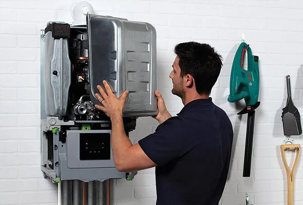 Heating engineer servicing a boiler in a Sheffield home
