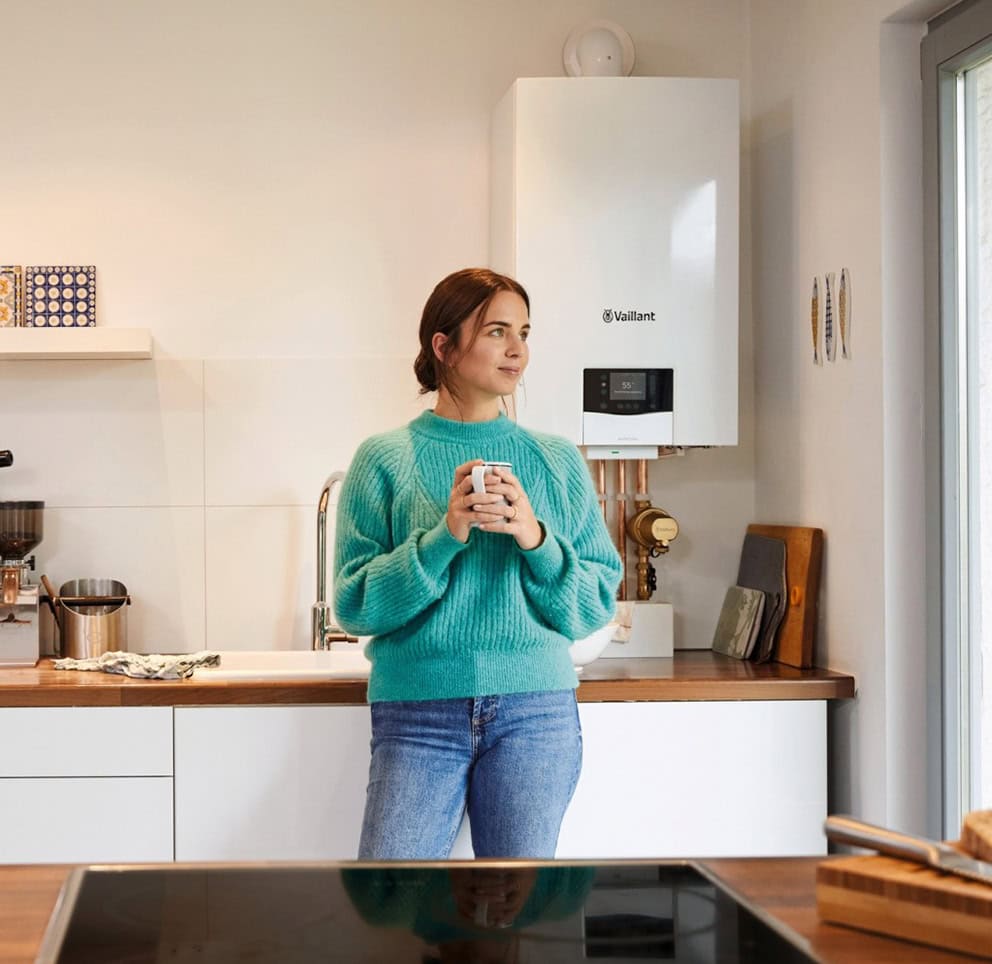 Homeowner with an energy efficient boiler in a modern Sheffield kitchen